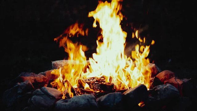 UHD slow motion shot of the burning campfire