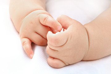 Fototapeta na wymiar baby boy's hand on white background
