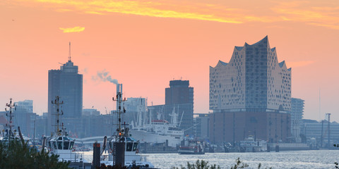 Elbe Philharmonic Hall (Elbphilharmonie) and River Elbe panorama in autumn at morning with sunrise...