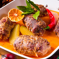 Wintry beef roulades with plum and bacon stuffing and cucumber