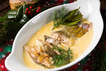 fried christmas carp in butter sauce with dill and lemon