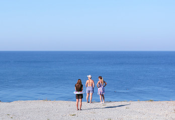 girls on the way to the beach on the high Bank