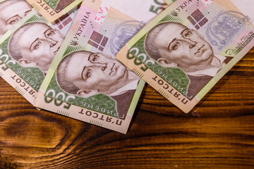 Ukrainian five hundred hryvnas banknotes on wooden table