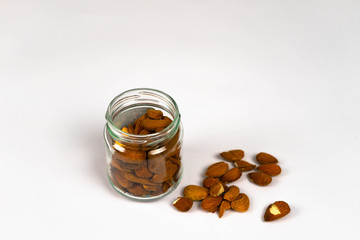 Almonds, walnuts and hazelnuts on wooden table / assortment of nuts Nuts muscle food Healthy mix nuts on wooden background. Almonds, hazelnuts assortment of tasty nuts, close up 