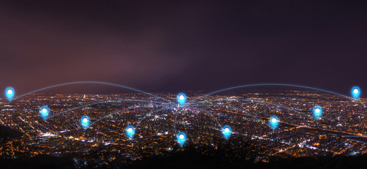 pin flat above night cityscape and glowing networking connection as communication concept
