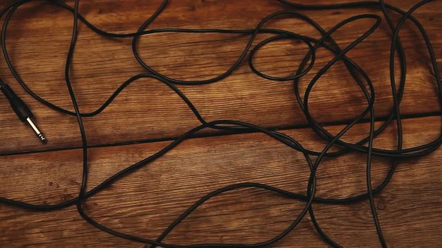 Long audio cable wooden sharp table hd footage