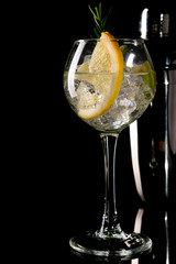 mojito cocktail with lime isolated on black background.