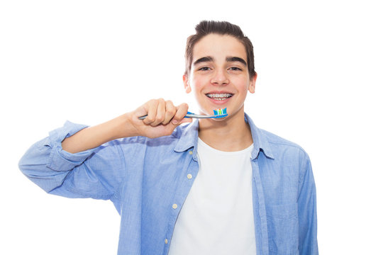 young with braces with toothbrush