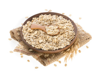 Rolled oats, healthy breakfast cereal oat flakes isolated on white