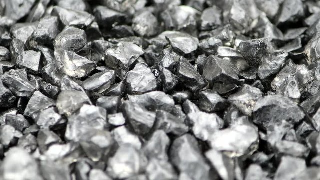 Gray split stones rotate on a turntable