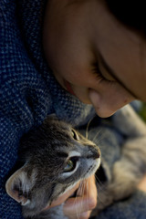 Little girl holding cat