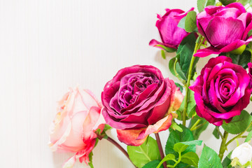 Fototapeta na wymiar rose flower plastic on white wallpaper background