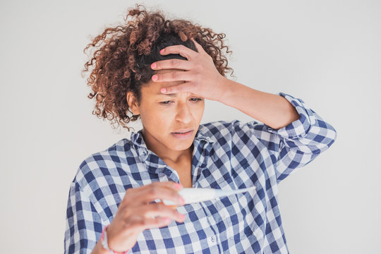 Worried Black Woman Watching Pregnancy Test Result