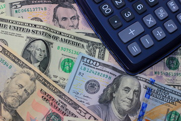 Fototapeta premium background different denomination of banknotes. calculator money account