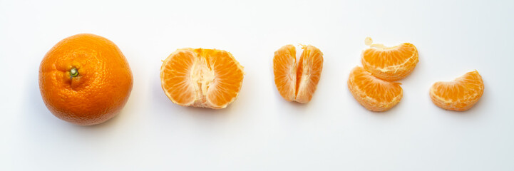 One tangerine and tangerine slices , isolated on white, banner