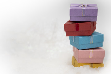 gift boxes on the white fur with copy space for season greeting Merry Christmas or Happy New Year