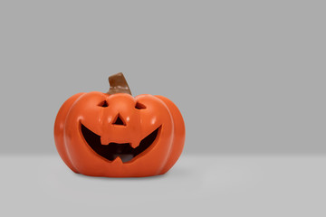 Halloween pumpkin on grey background