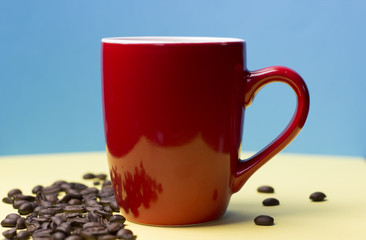 Red coffee cup with beens concept