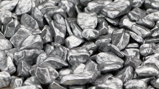 Silver split stones rotate on a turntable
