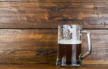 cup of beer on wood