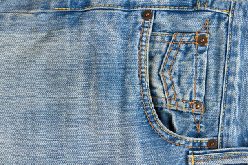 Close up of denim jeans texture with seams. Pocket of brand jeans. Part of blue classic jeans close up.