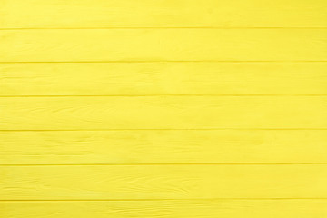 Yellow wooden boards background. Colored horizontal planks background. Natural wooden background...