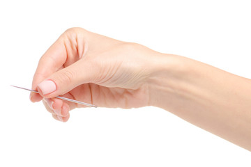 sewing needle in hand on a white background. Isolation