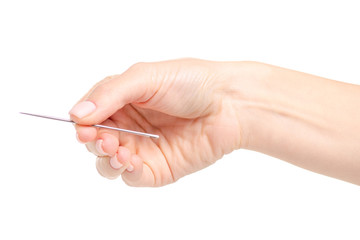 sewing needle in hand on a white background. Isolation