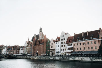 Fototapeta na wymiar September 1, 2018 - Gdansk / Poland: Architecture of Gdansk, Poland in pier in Old Town Center. Buildings and old ship.