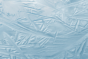 Abstract background of the first ice on the water surface