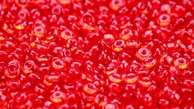 Red beads rotate on a turntable