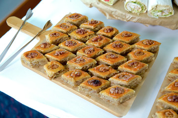 Traditional pakhlava baklava pastry on novruz tray with dry fruits snack. Azerbaijan national Novruz eastern new year spring celebration concept