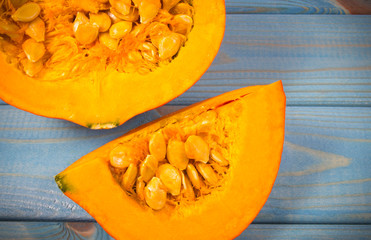 Pumpkins on rustic blue background. Autumn background.