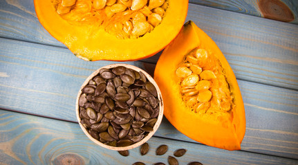 Pumpkins on rustic blue background. Autumn background.