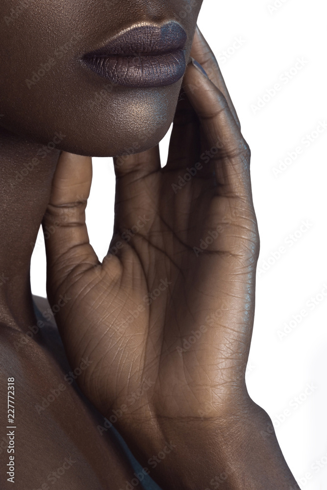 Sticker palm and lips of young beautiful black woman with clean perfect skin close-up