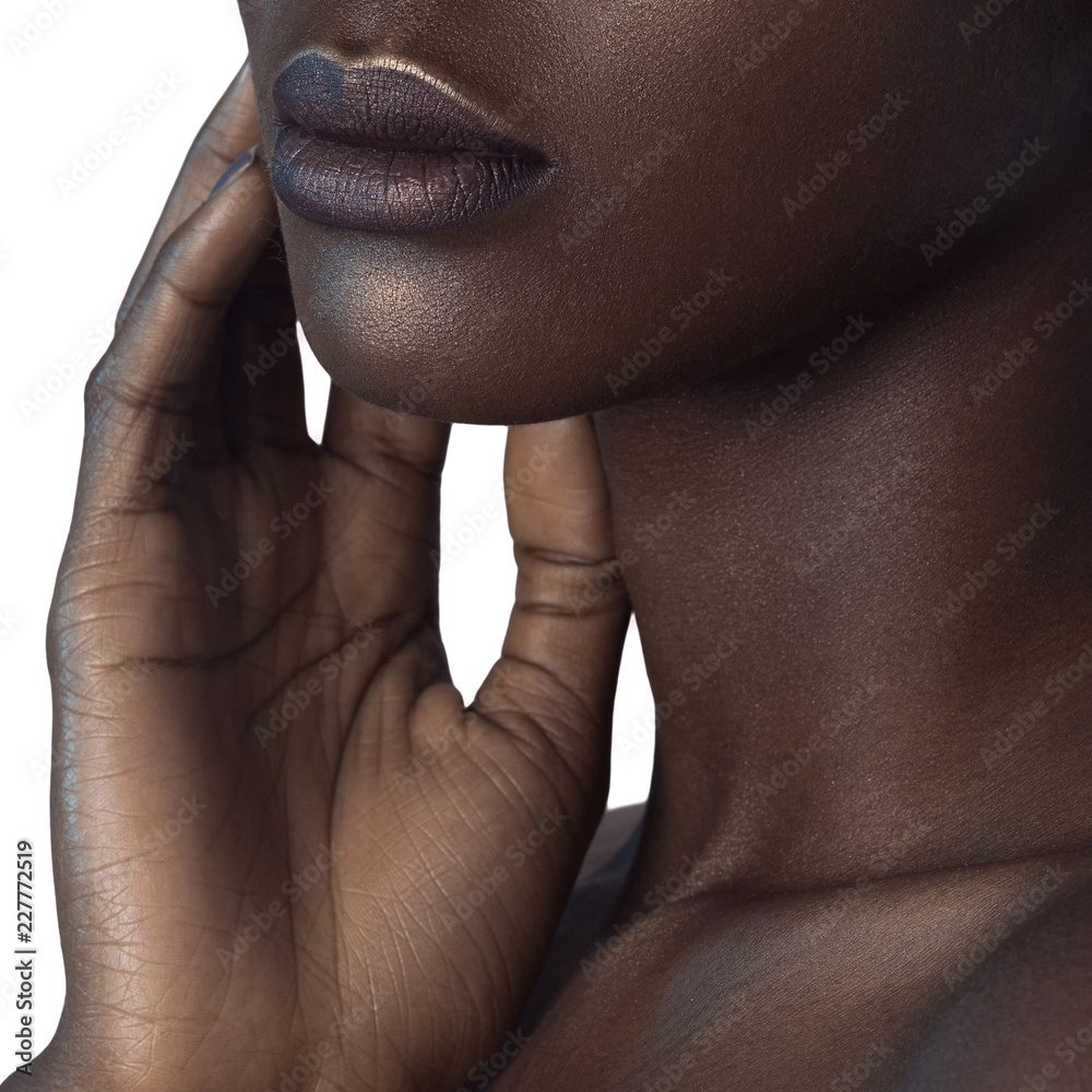 Wall mural palm and lips of young beautiful black woman with clean perfect skin close-up