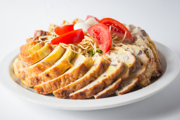 Minced chicken with pasta, tomatoes and reed eggs on the plate