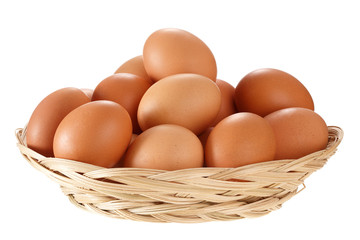Eggs in a wicker basket. Isolated on white background.