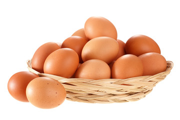 Eggs in a wicker basket. Isolated on white background.