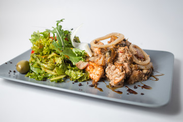 Seafood salad with squid, crayfish, mussels and green