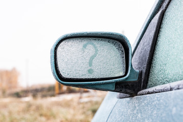 Frozen rear view mirror question mark. The question mark on the glass
