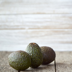 Avocado on old wooden background