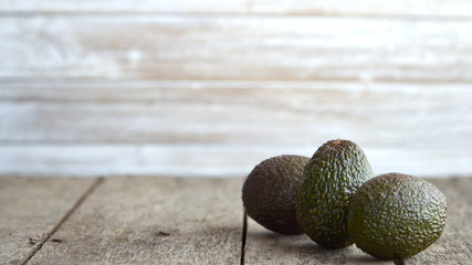 Avocado on old wooden background