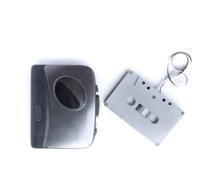 Old cassette player and cassette tape isolated on white background