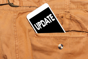 update text on phone screen / Smartphone in front pant pocket, upgrade concept