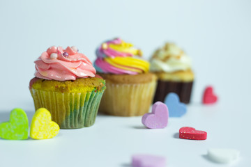 Colorful cupcakes on a white background