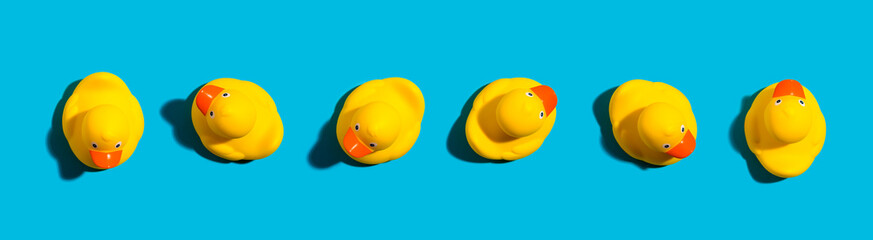 Collection of yellow rubber ducks on a blue background