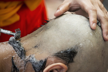 hair shaving for ordain as a young monk .