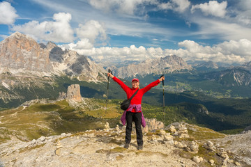 Sporty Young woman on mountain trail Dolomites Mountains, Italy