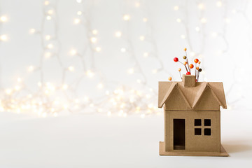 Autumn themed mini craft home on a shiny light background